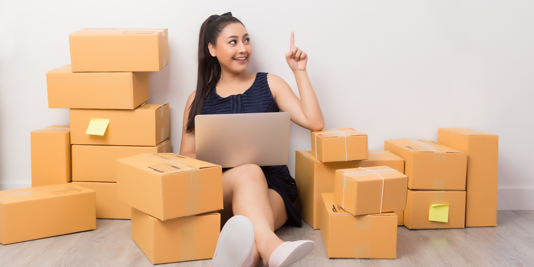 business owner working at home office packaging on background